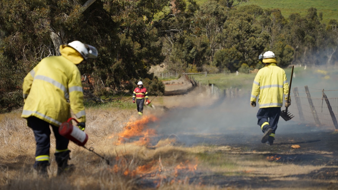ERT crew running fire suppression during a live bushfire training exercise