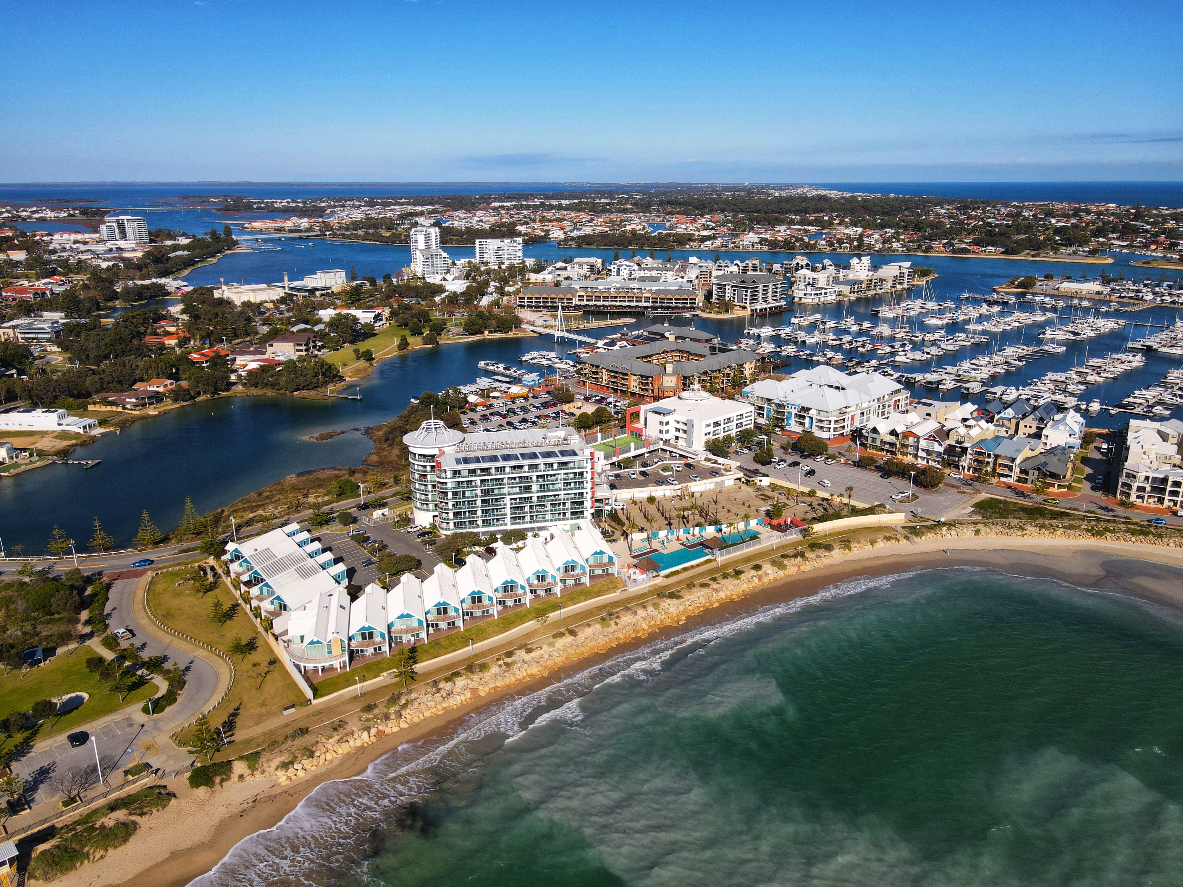 Aerial view of Mandurah — the marina, estuary canals, beach and peri-urban housing